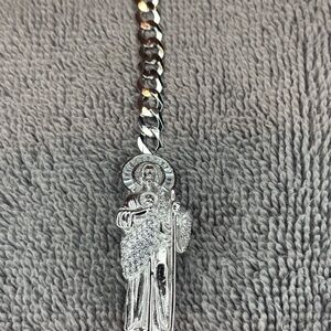 Elegant Silver Bracelet with Saint Pendant